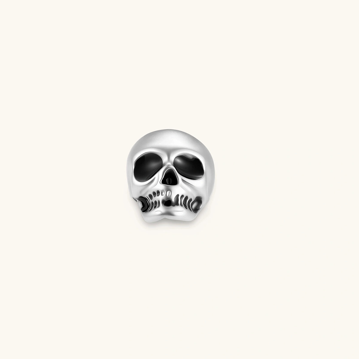Matte silver skull stud earring with black enamel eye sockets and detailed teeth, post backing, 316L stainless steel.
