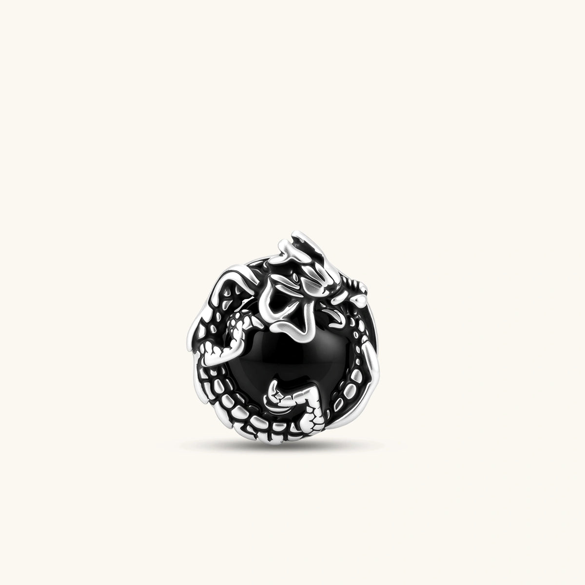 Silver stainless steel stud earring with coiled dragon motif wrapped around a black stone, shown from front and side.