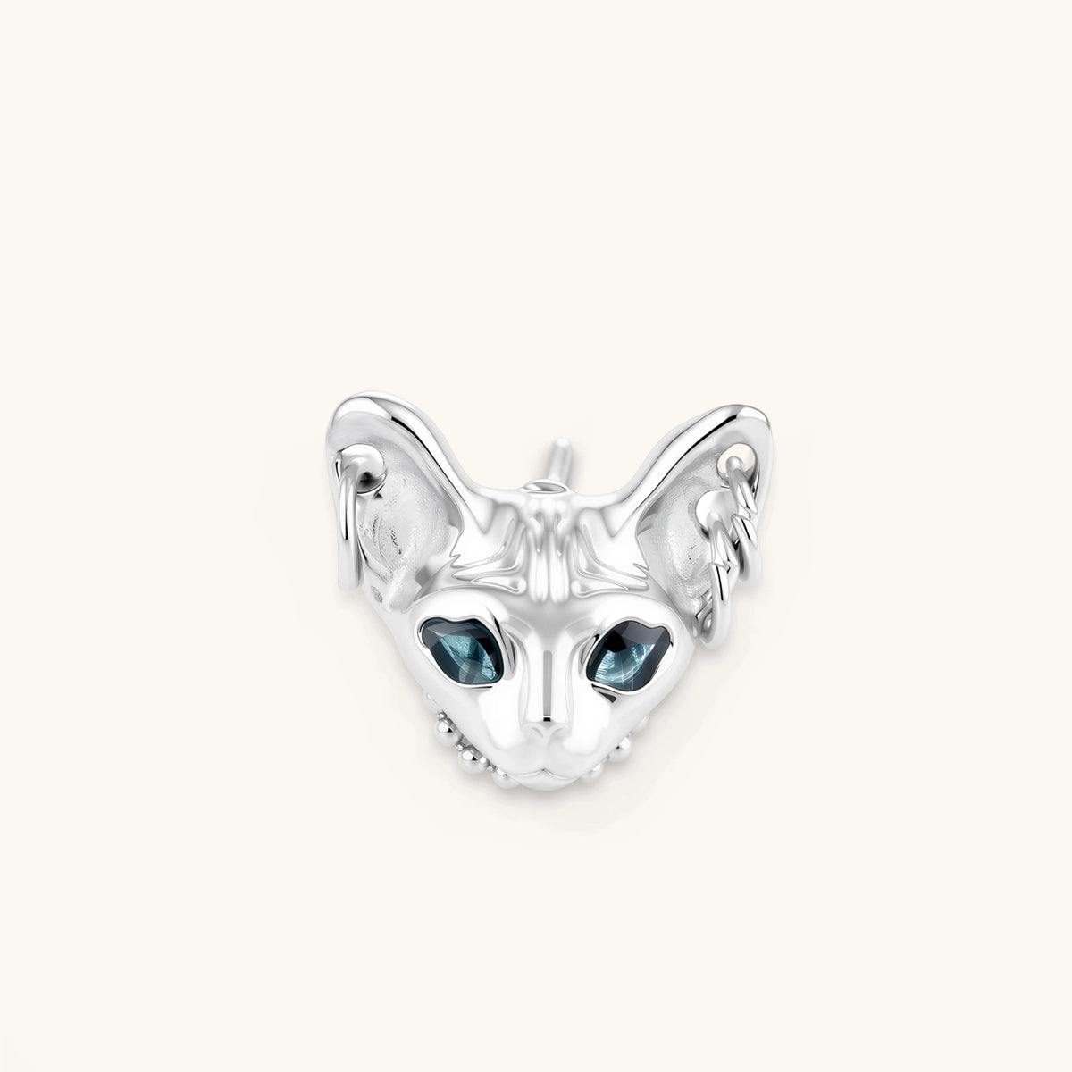 3D sculpted stainless steel Sphynx cat head stud earring with blue CZ eyes and hoop ear details, silver finish.