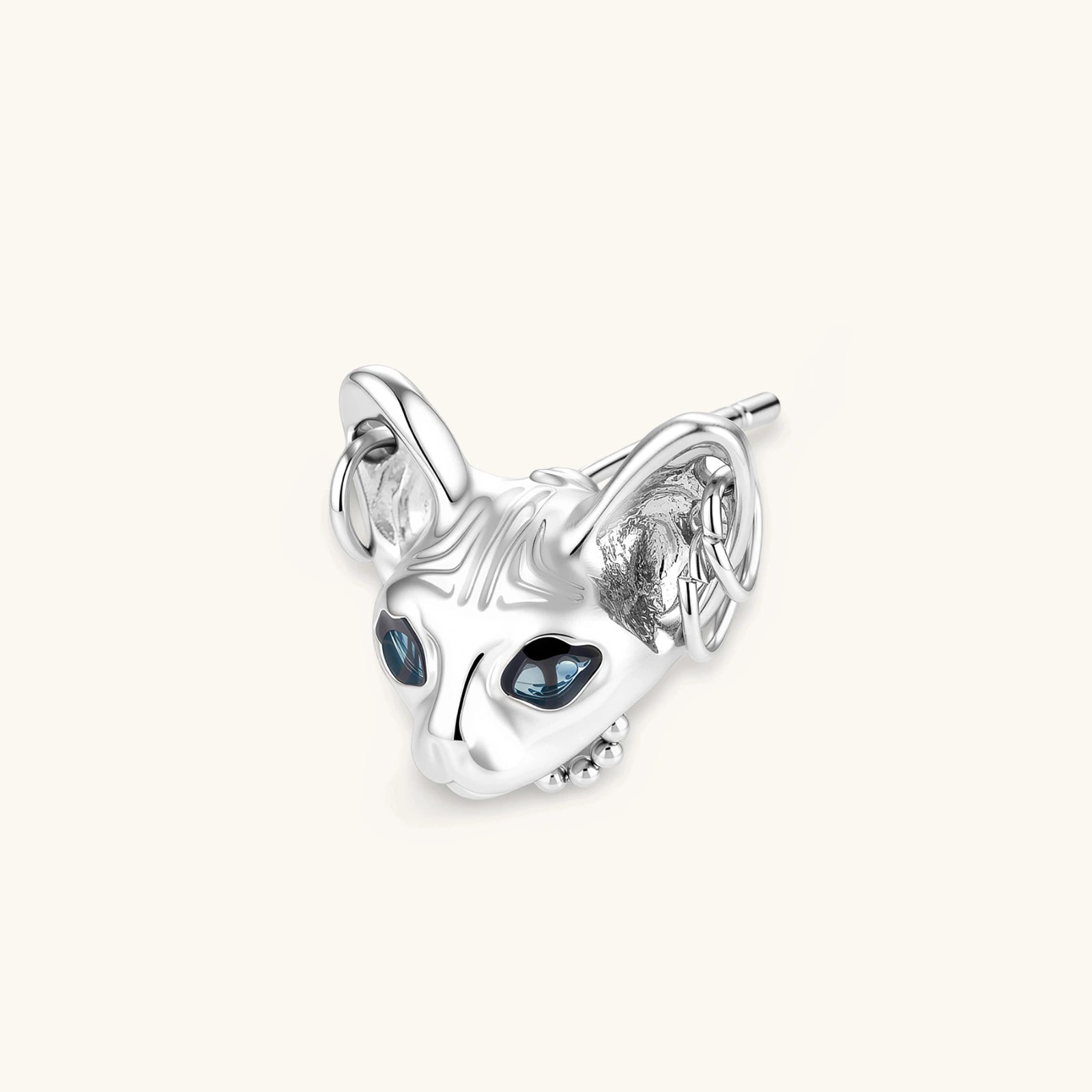 3D sculpted stainless steel Sphynx cat head stud earring with blue CZ eyes and hoop ear details, silver finish.