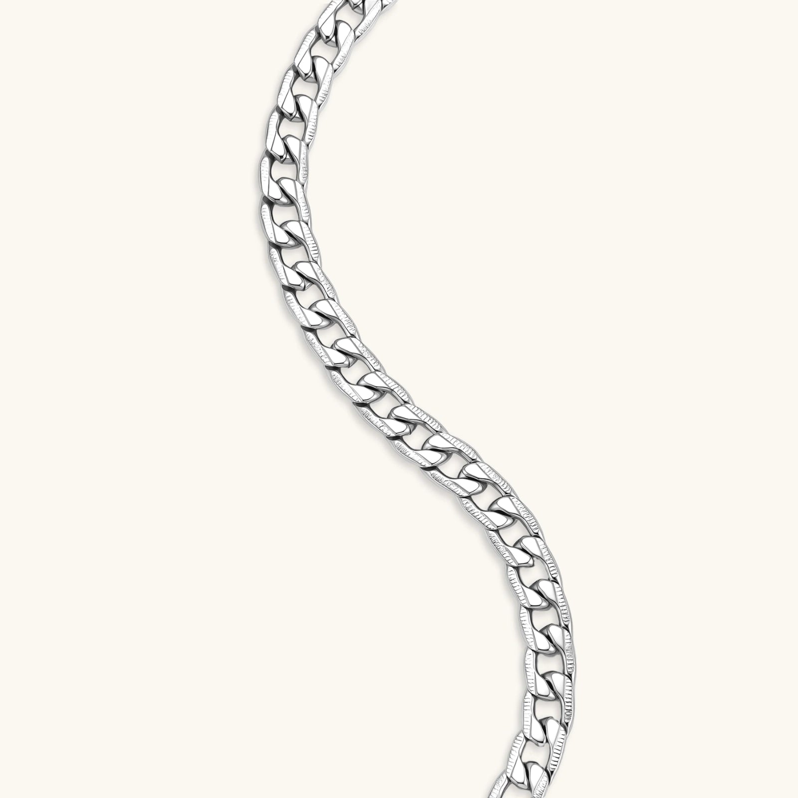 Silver 316L stainless steel carved curb chain necklace with lobster clasp and extender, 7.2mm wide, on cream background.