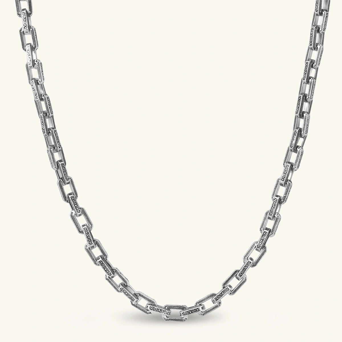 Silver 316L stainless steel rectangular link chain necklace with intricate scroll engravings, 560mm length, 7.1mm width.