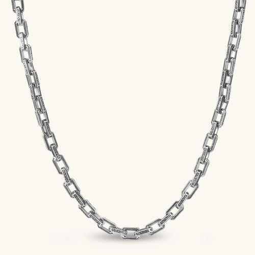 Silver 316L stainless steel rectangular link chain necklace with intricate scroll engravings, 560mm length, 7.1mm width.