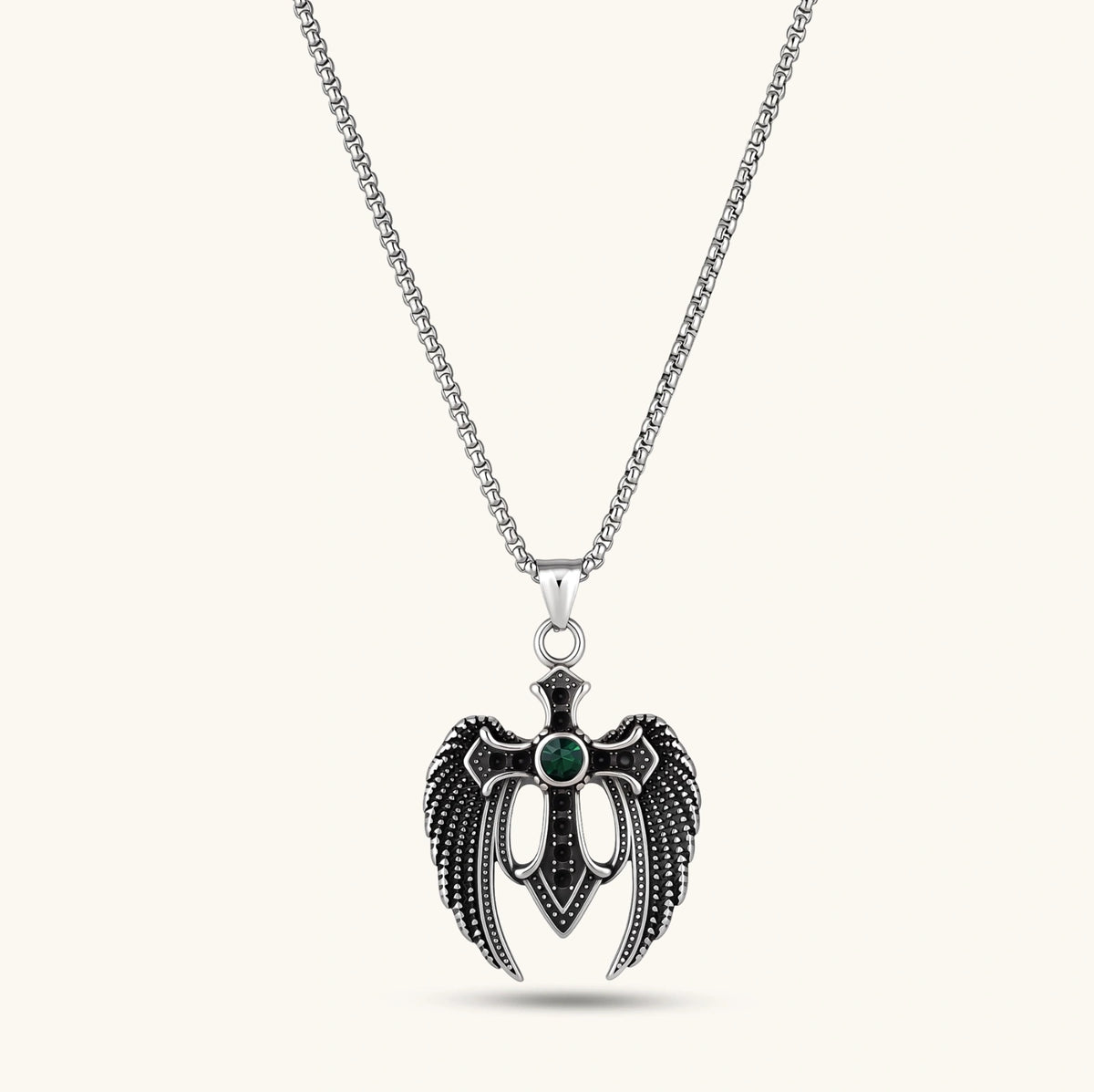 Silver stainless steel angel wing cross pendant necklace with green CZ center stone and black crystals on a box chain.