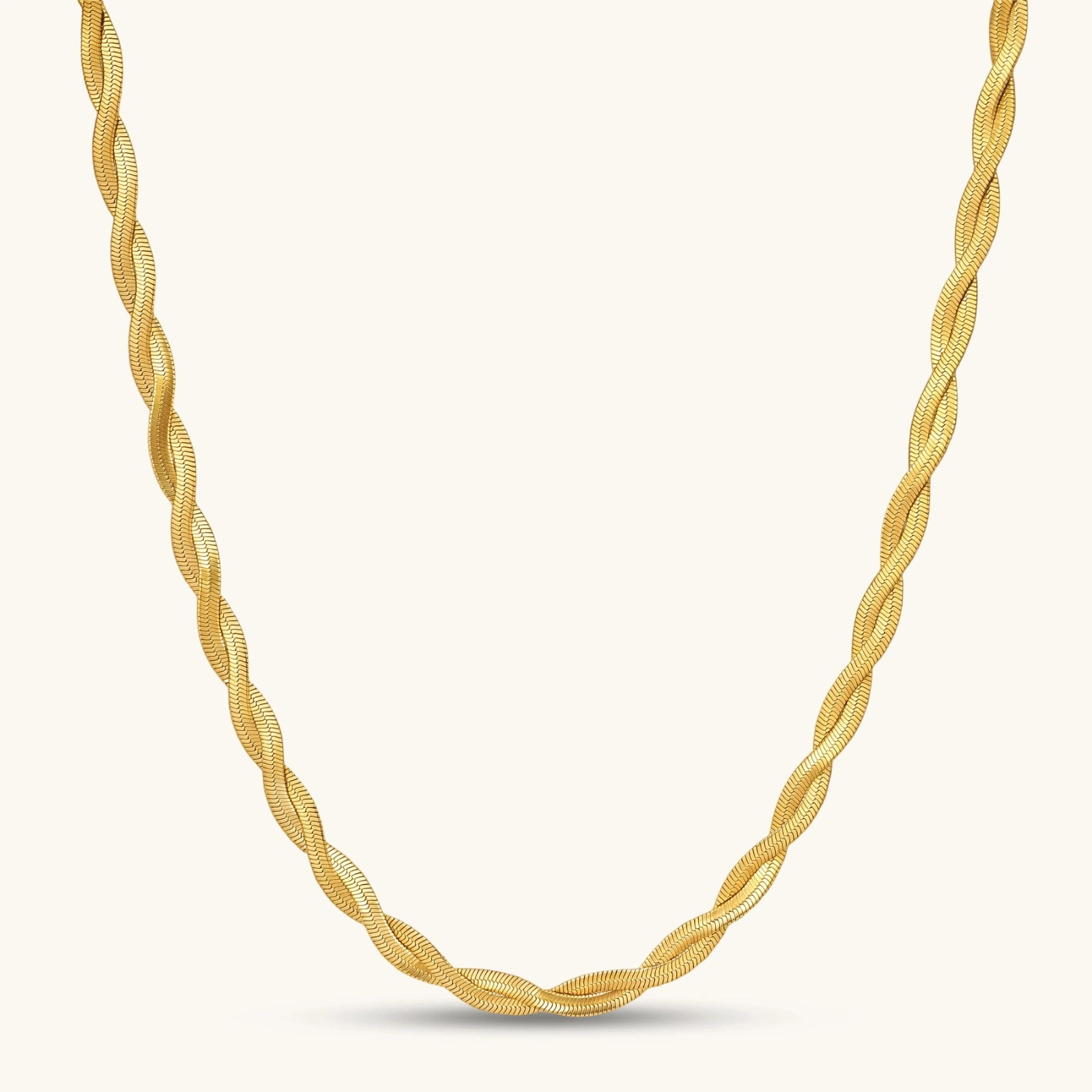 18K gold-plated twisted double herringbone snake chain necklace with lobster clasp and extender on white background.