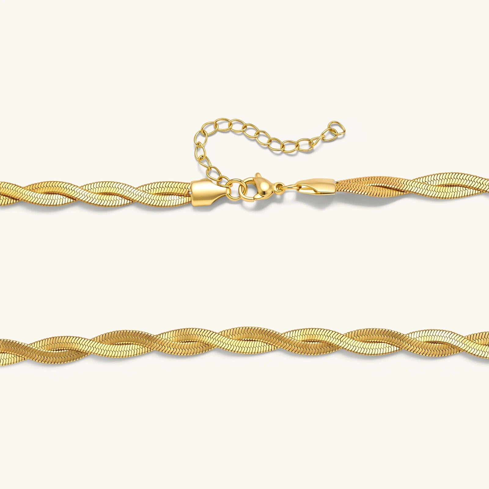 18K gold-plated twisted double herringbone snake chain necklace with lobster clasp and extender on white background.