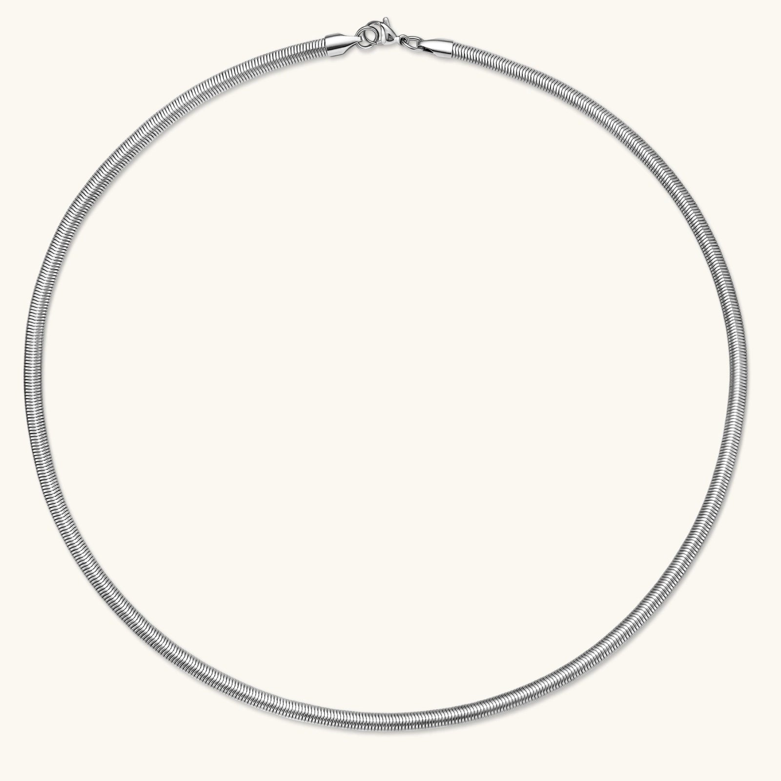 Two-tone twisted necklace with interlocked gold and silver ribbed snake chains, 6mm wide, on a white background.
